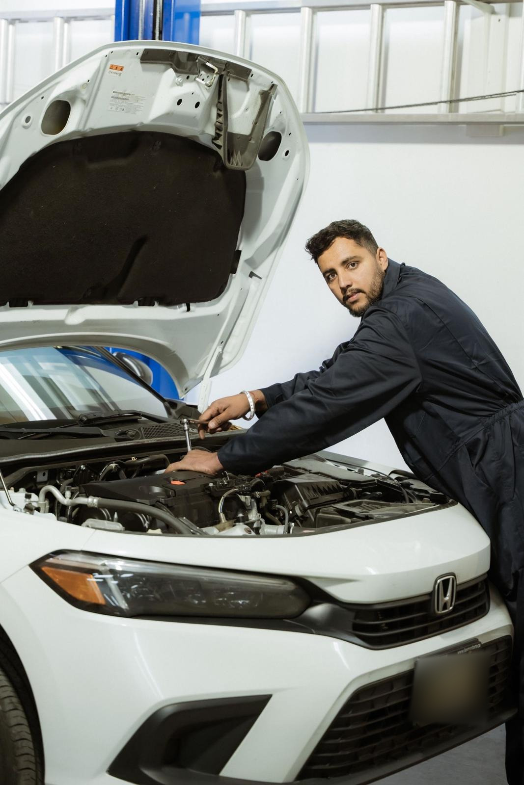 Easy Auto Solutions mechanic working on a vehicle engine