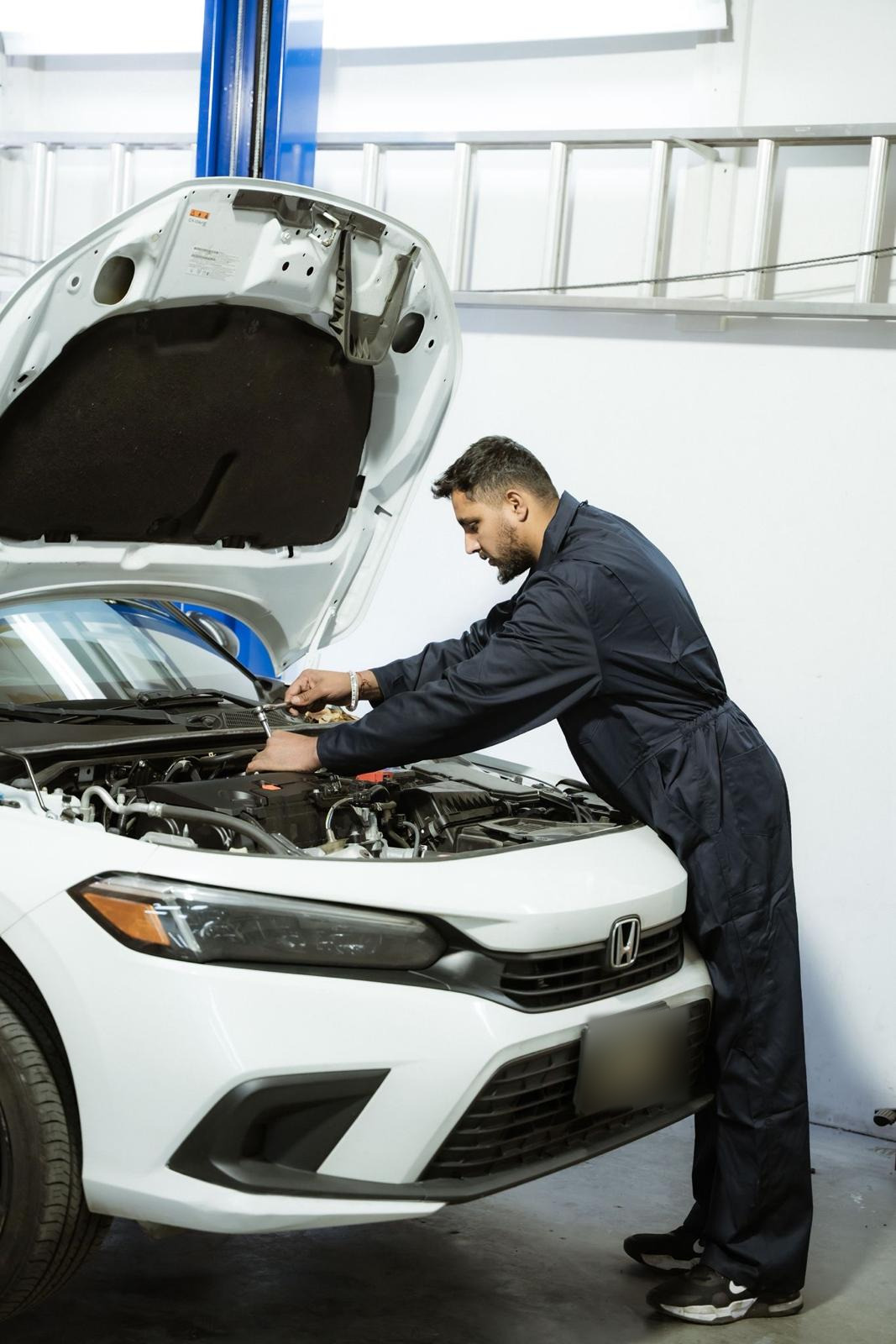 Easy Auto Solutions technician inspecting a vehicle